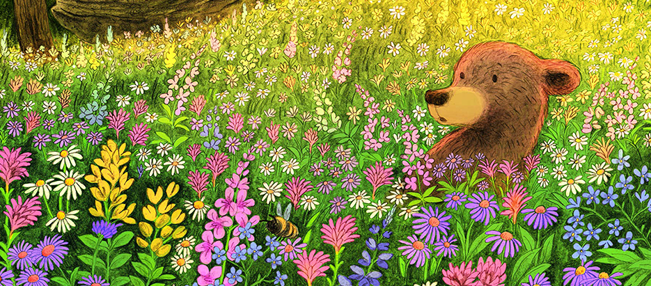 Imagen del libro Little Bear's Spring. El oso está hundido en las flores