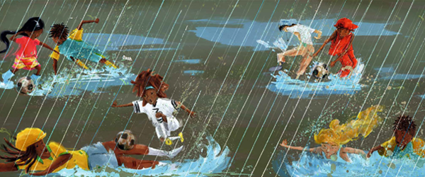 Los niños juegan al fútbol entre la lluvia y el barro