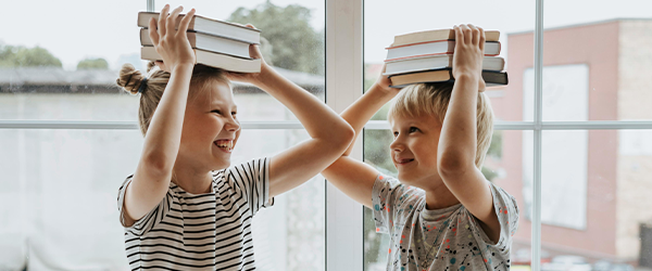Kids with books on their heads