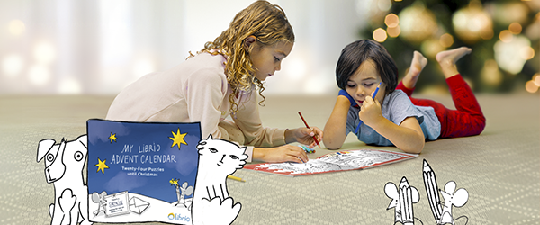 Two girls playing with their Advent Calendar