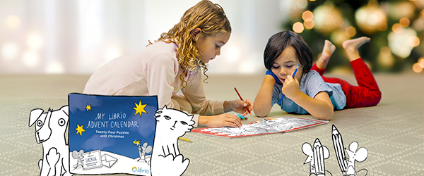 Two girls playing with their Advent Calendar