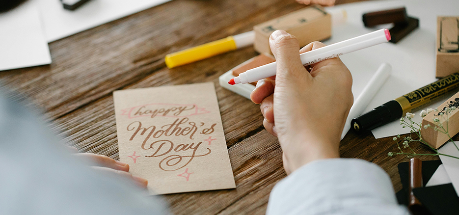 Mother's Day card with someone writing it