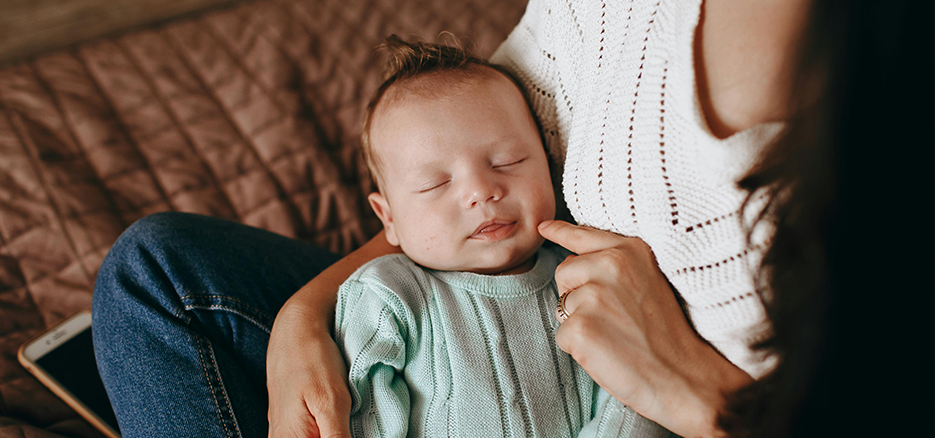 A baby in a mother's arms